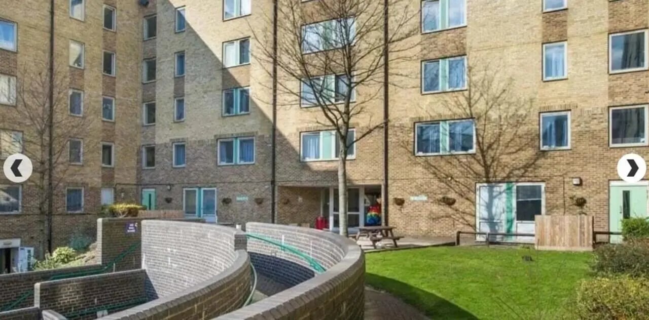 Building exterior with brick facade and windows exterior at Dinwiddy House in London Student Accommodation
