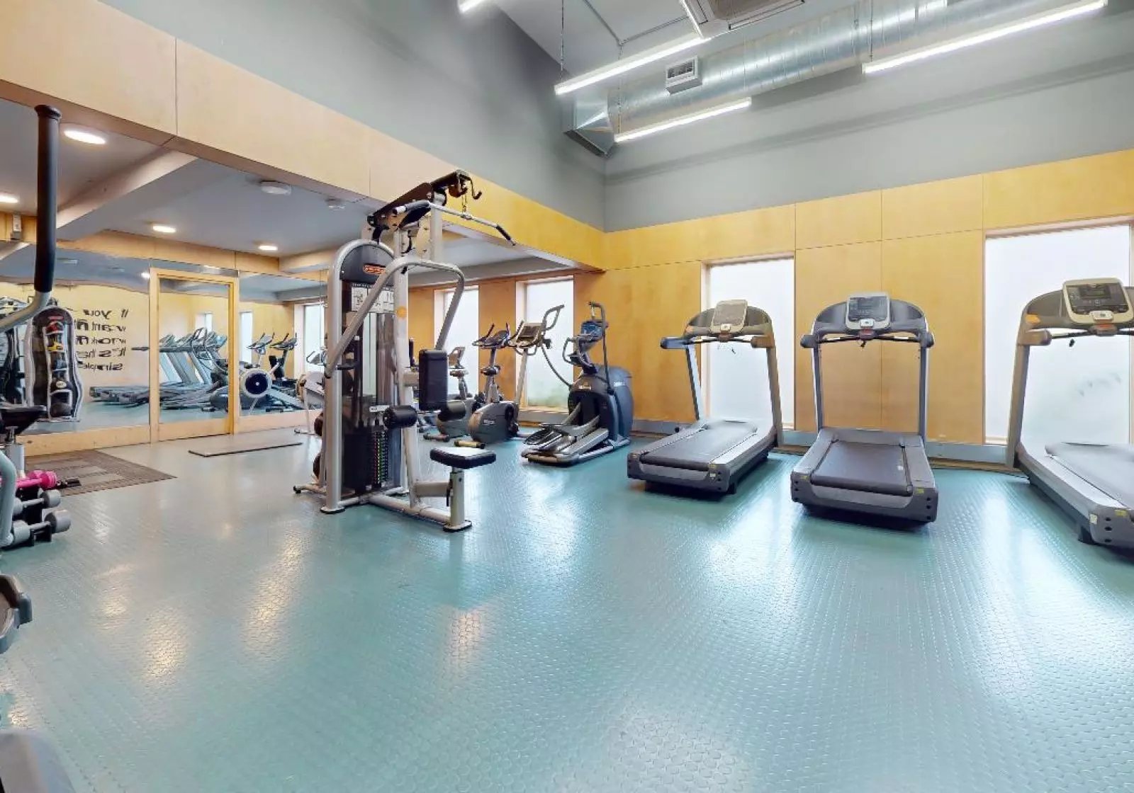 Gym equipment treadmills and weight machines fitness area at iQ Arkwright House in Bradford Student Accommodation