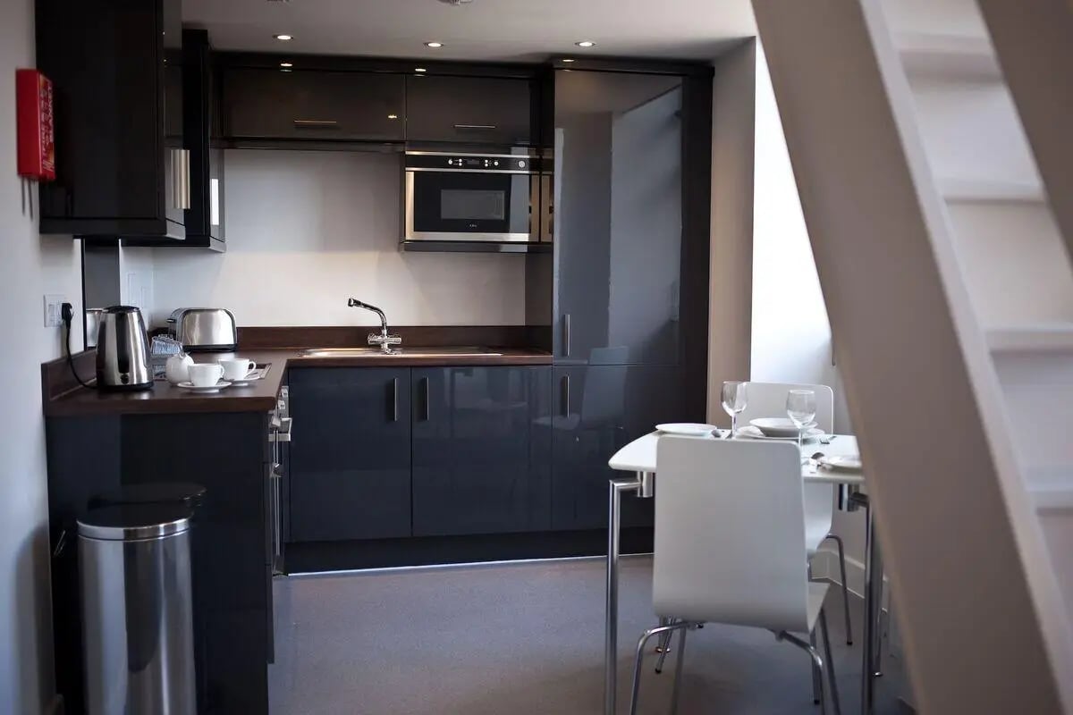 Modern kitchen with dining area and microwave kitchen at Dean Clarke Lofts in Exeter Student Accommodation