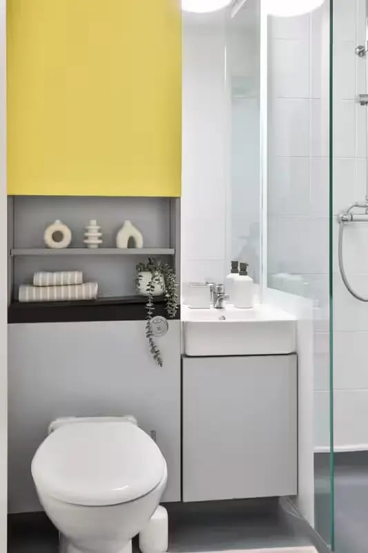 Toilet sink shelving with decor and shower bathroom at Hayward House in Liverpool Student Accommodation