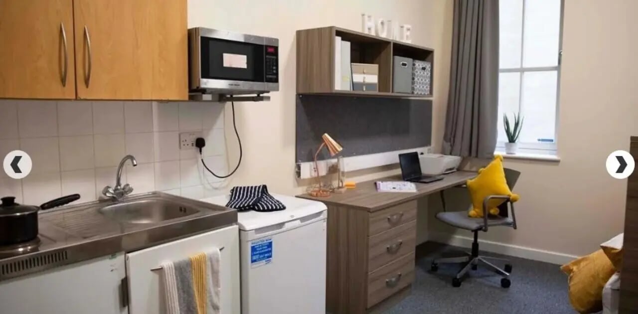 Sink microwave desk and printer student studio at Lilian Knowles House in London Student Accommodation