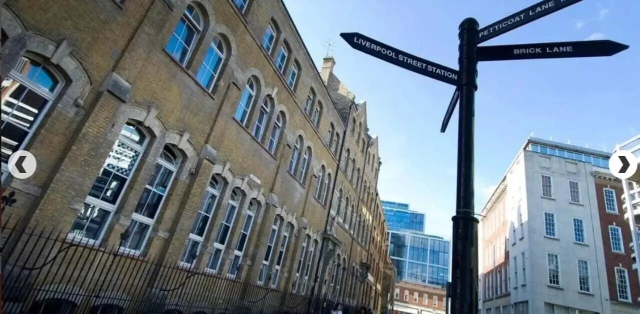 Street signs and brick building exterior at Lilian Knowles House in London Student Accommodation