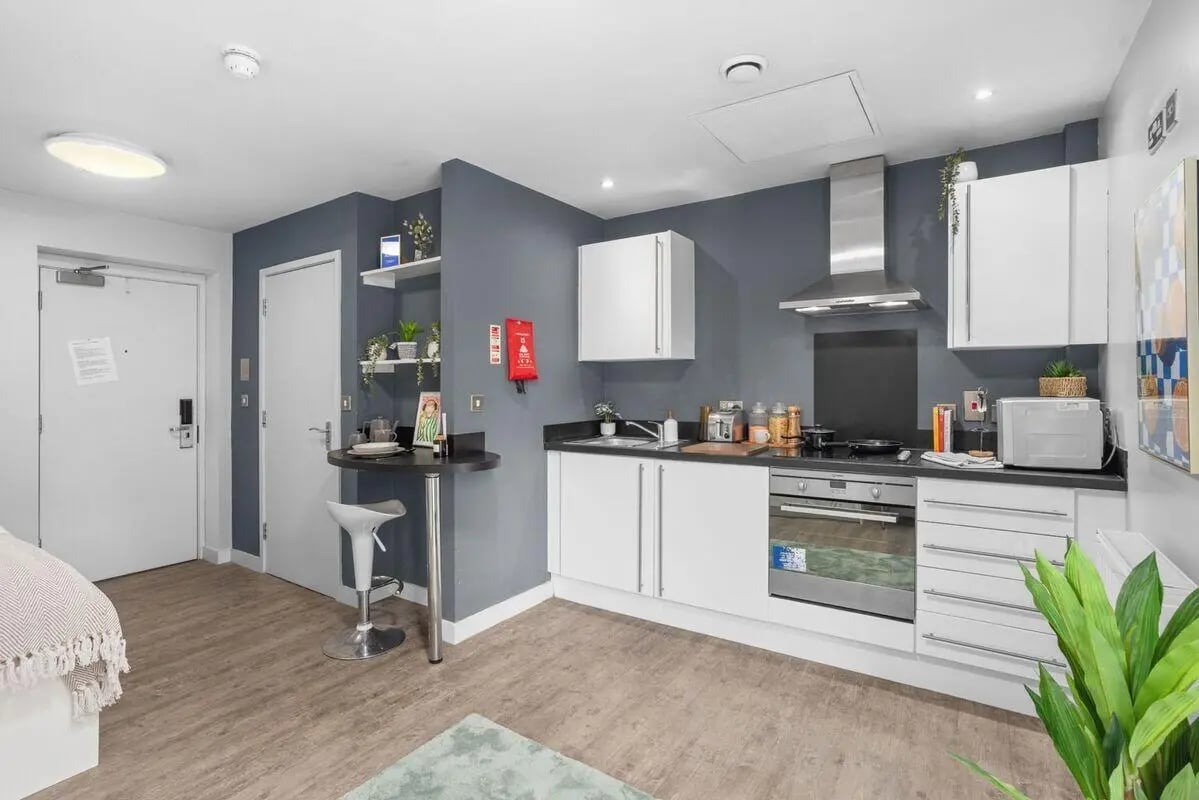 Kitchenette with breakfast bar and cabinets Kitchen area at Alwyn Court in Cardiff Student Accommodation
