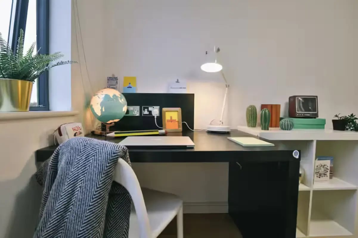 Desk with globe lamp and laptop study area at Chatham Lodge in Liverpool Student Accommodation