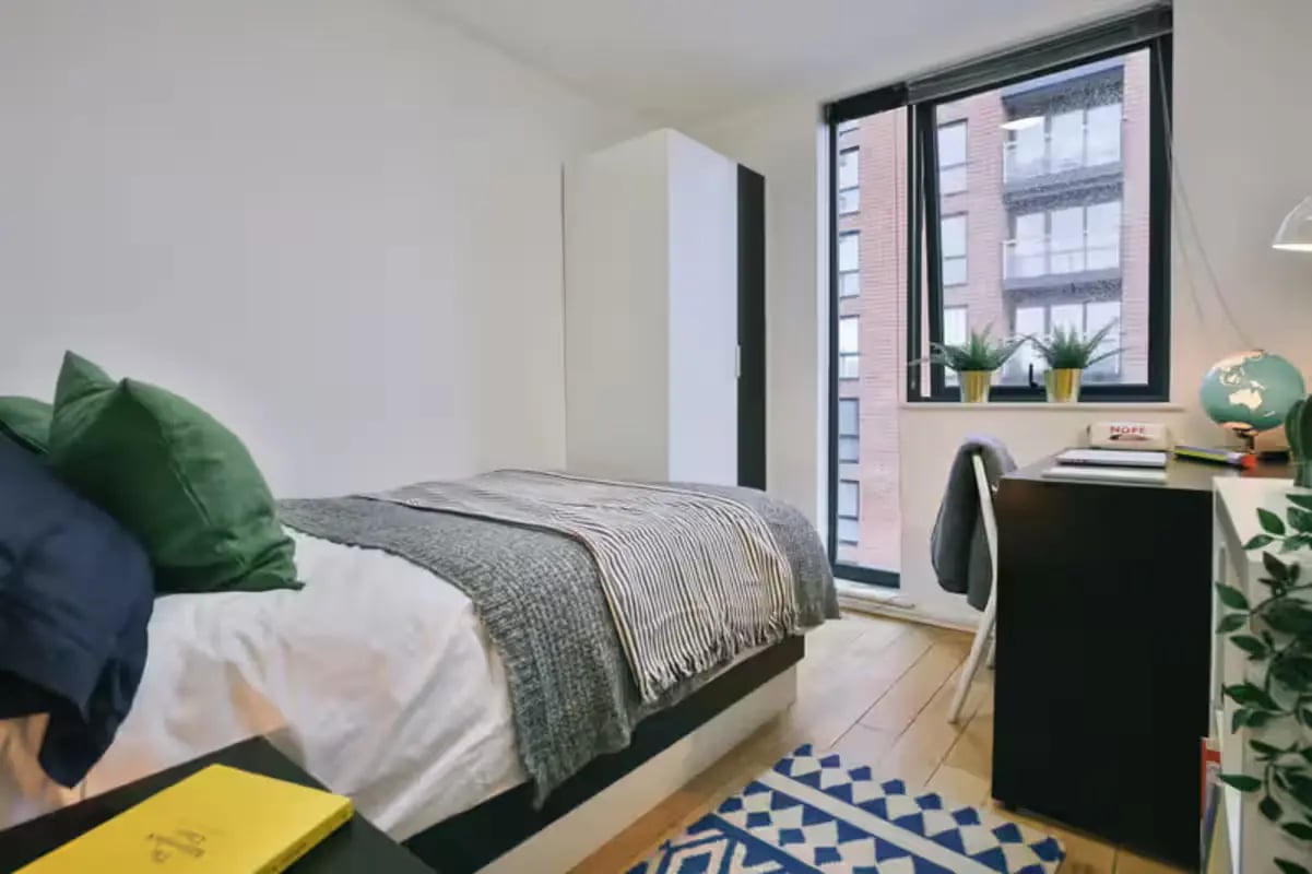 Bed desk wardrobe with city view bedroom at Chatham Lodge in Liverpool Student Accommodation