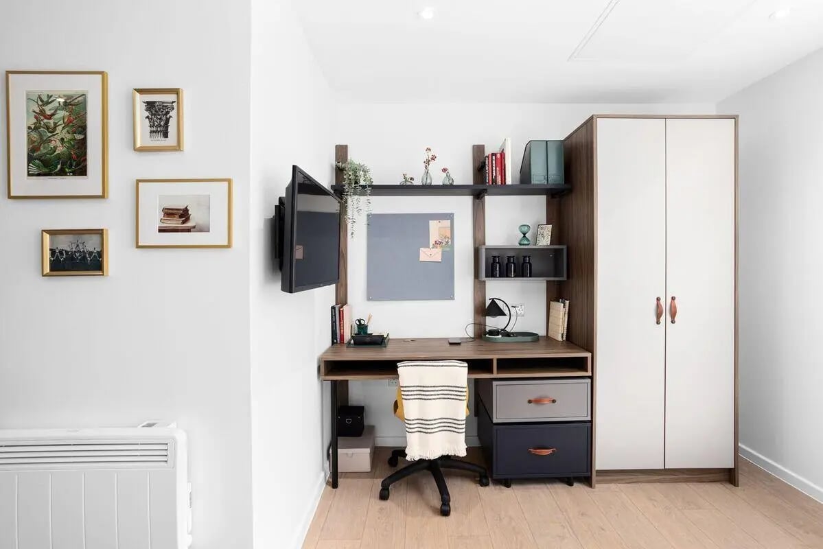 Framed art TV desk chair and wardrobe study area at Summit House in Cardiff Student Accommodation