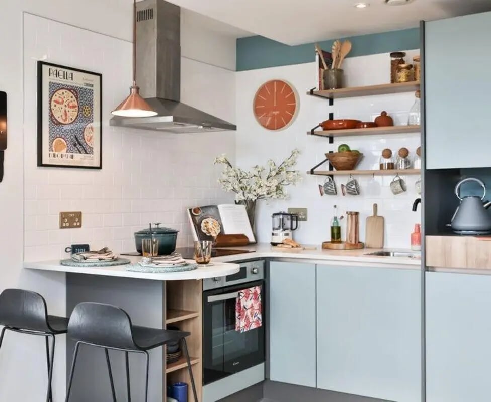 Stove oven counter chairs and shelving kitchen at Summit House in Cardiff Student Accommodation