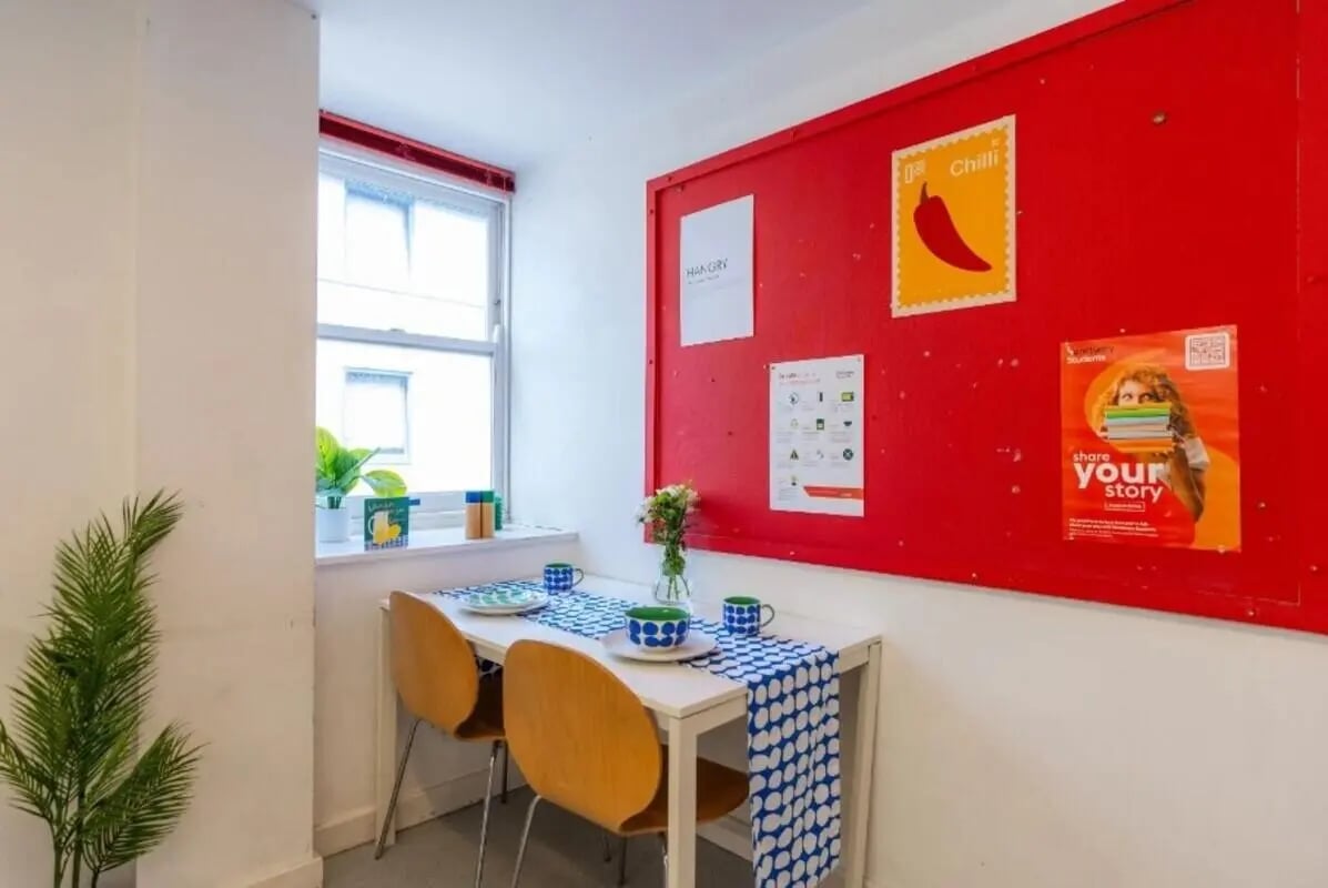 Table with chairs and window dining area at The Craft Building in London Student Accommodation