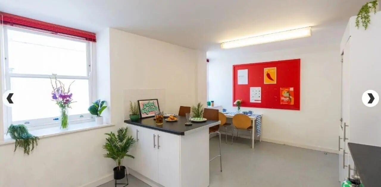 Kitchen with island and dining table kitchen at The Craft Building in London Student Accommodation