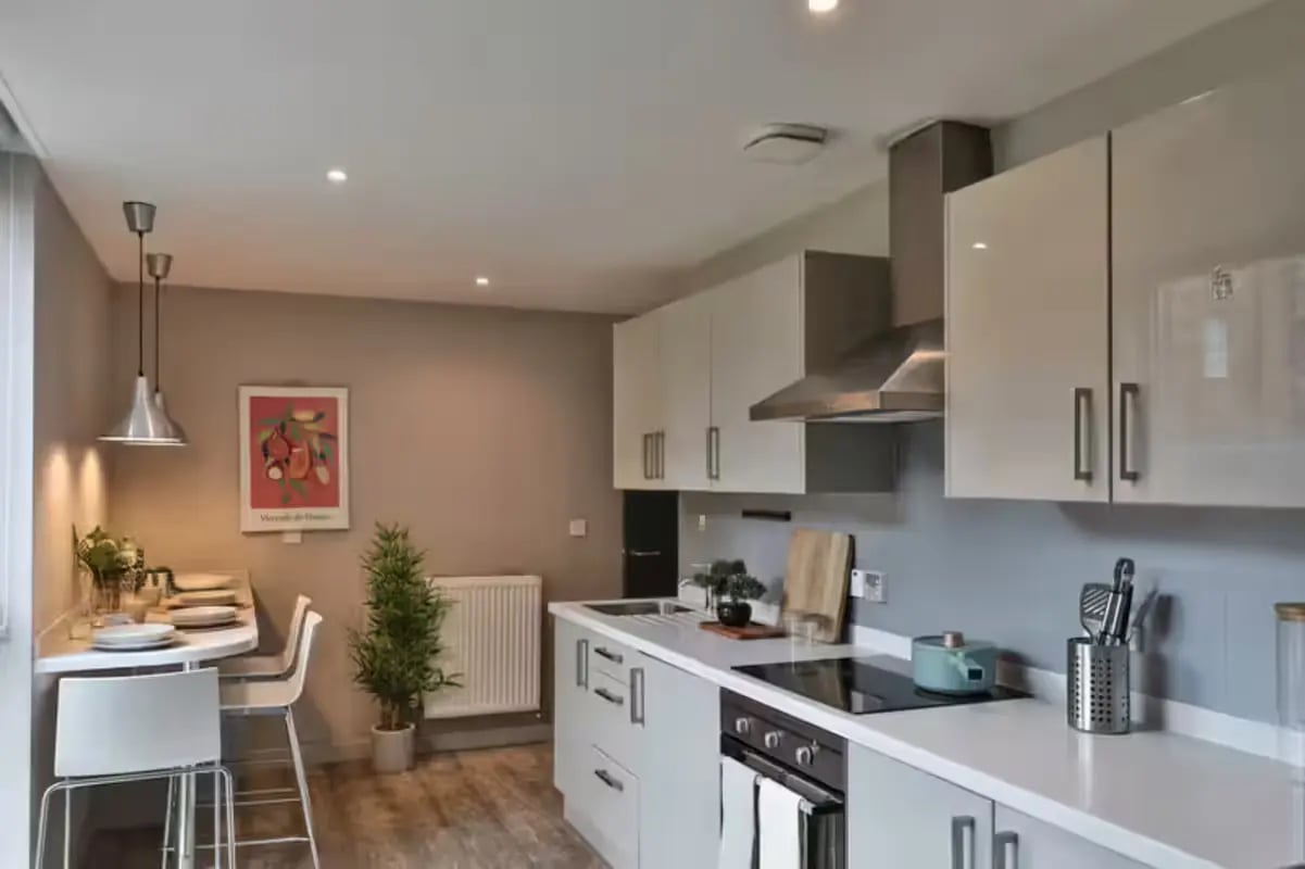 Modern kitchen with bar stools and dining table kitchen at Buccleuch Street in Edinburgh Student Accommodation
