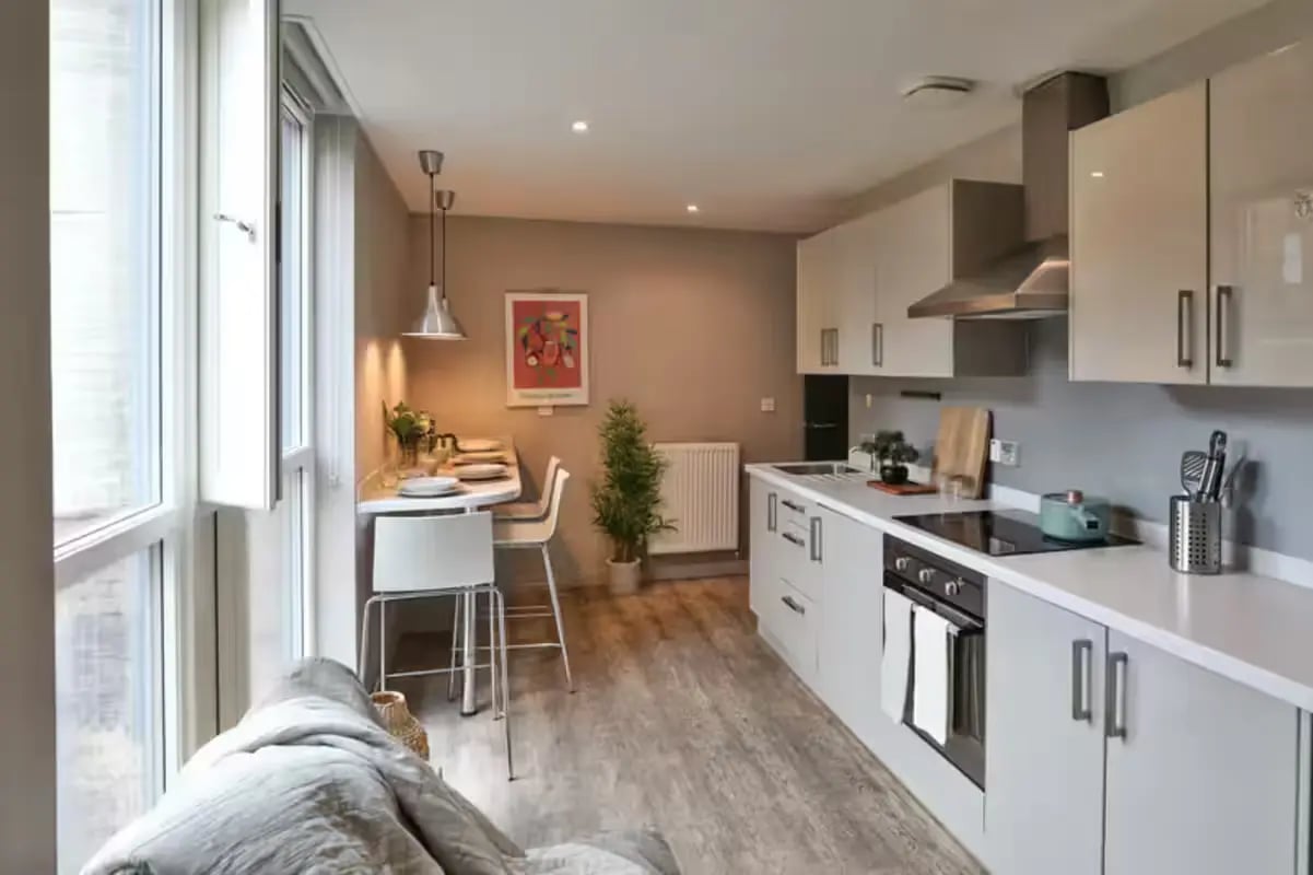 Modern kitchen with dining table and sofa kitchen at Buccleuch Street in Edinburgh Student Accommodation