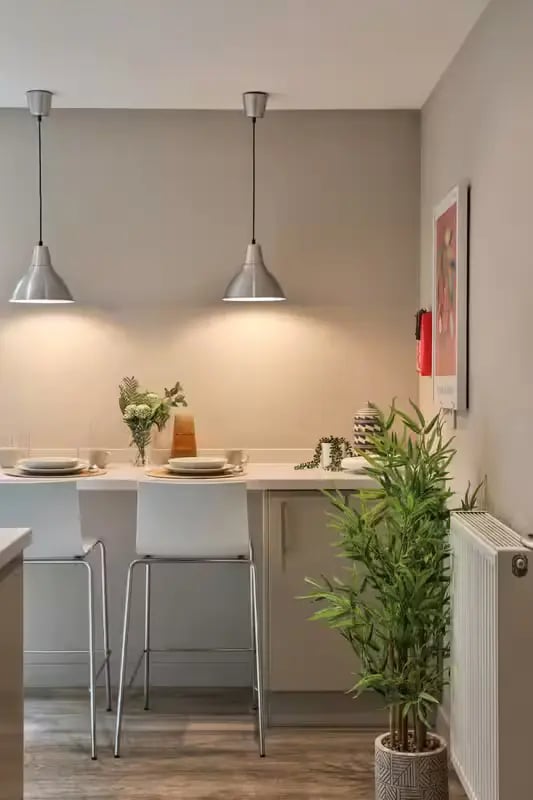 Two bar stools and breakfast bar kitchen at Buccleuch Street in Edinburgh Student Accommodation
