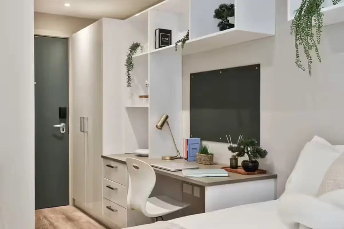 Desk with laptop chair and storage bedroom. at Buccleuch Street in Edinburgh Student Accommodation