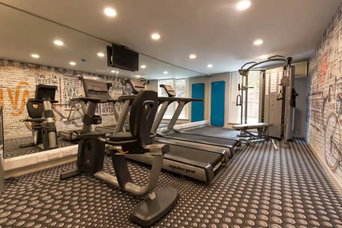 Treadmills exercise bikes weight machine gym area at Buccleuch Street in Edinburgh Student Accommodation