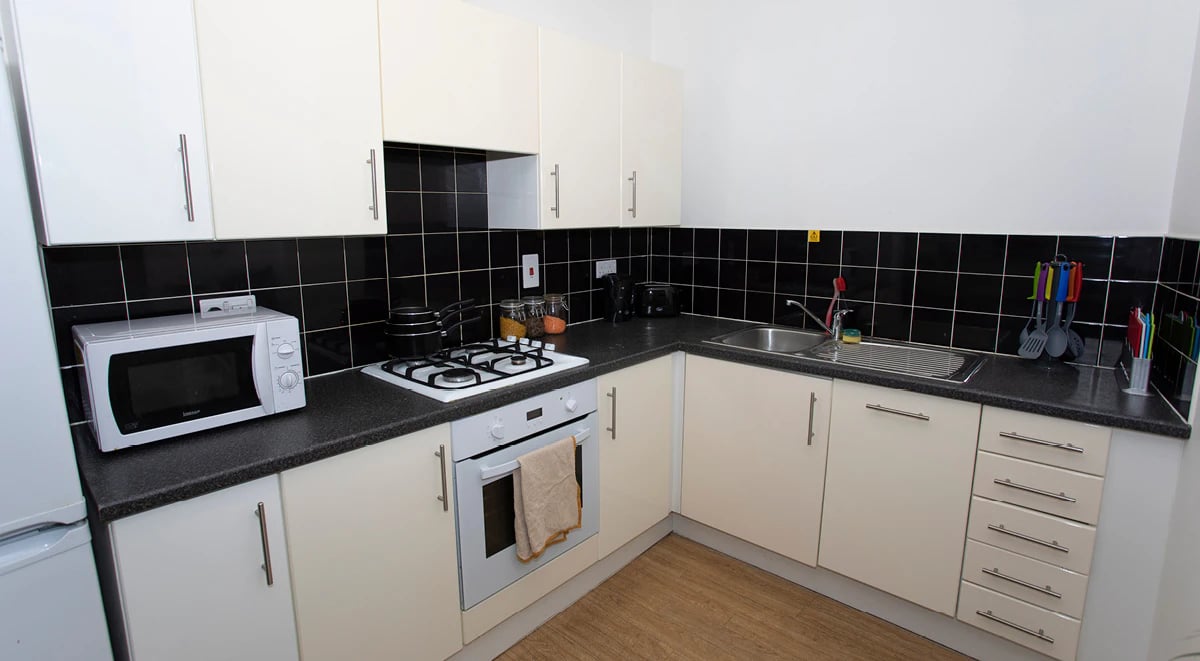 Microwave stove sink cabinets drawers kitchen at 200 Cowgate in Edinburgh Student Accommodation