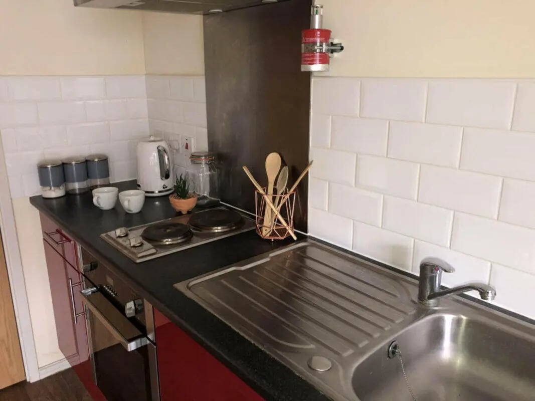 Compact kitchen with hob sink and kettle kitchen at Falkland House in Liverpool Student Accommodation