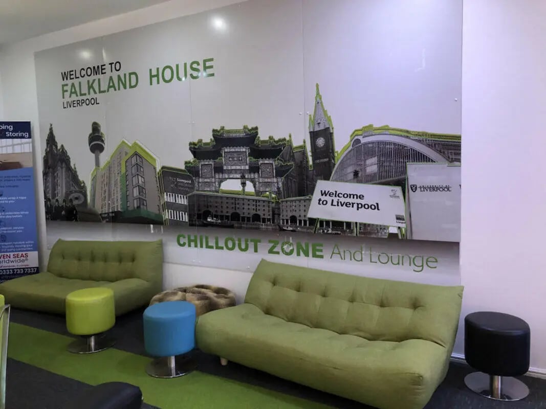 Green sofas and stools in lounge area at Falkland House in Liverpool Student Accommodation