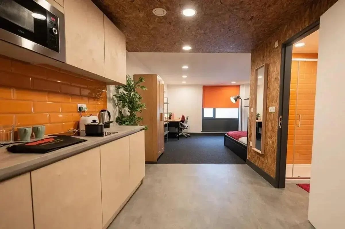 Kitchen counters microwave bed desk and shower bathroom at AXO Camden in London Student Accommodation