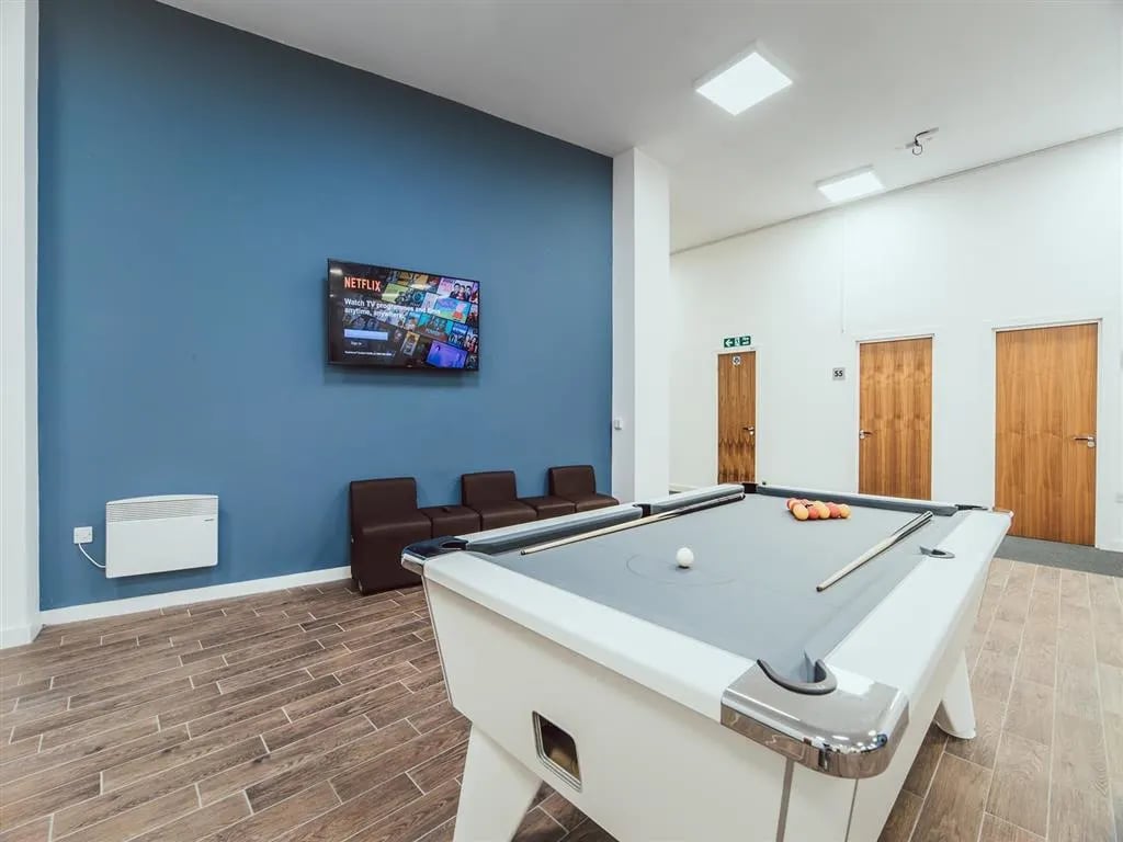 Pool table lounge with Netflix TV and seating playing area at Lomax Halls in Stoke-On-Trent Student Accommodation
