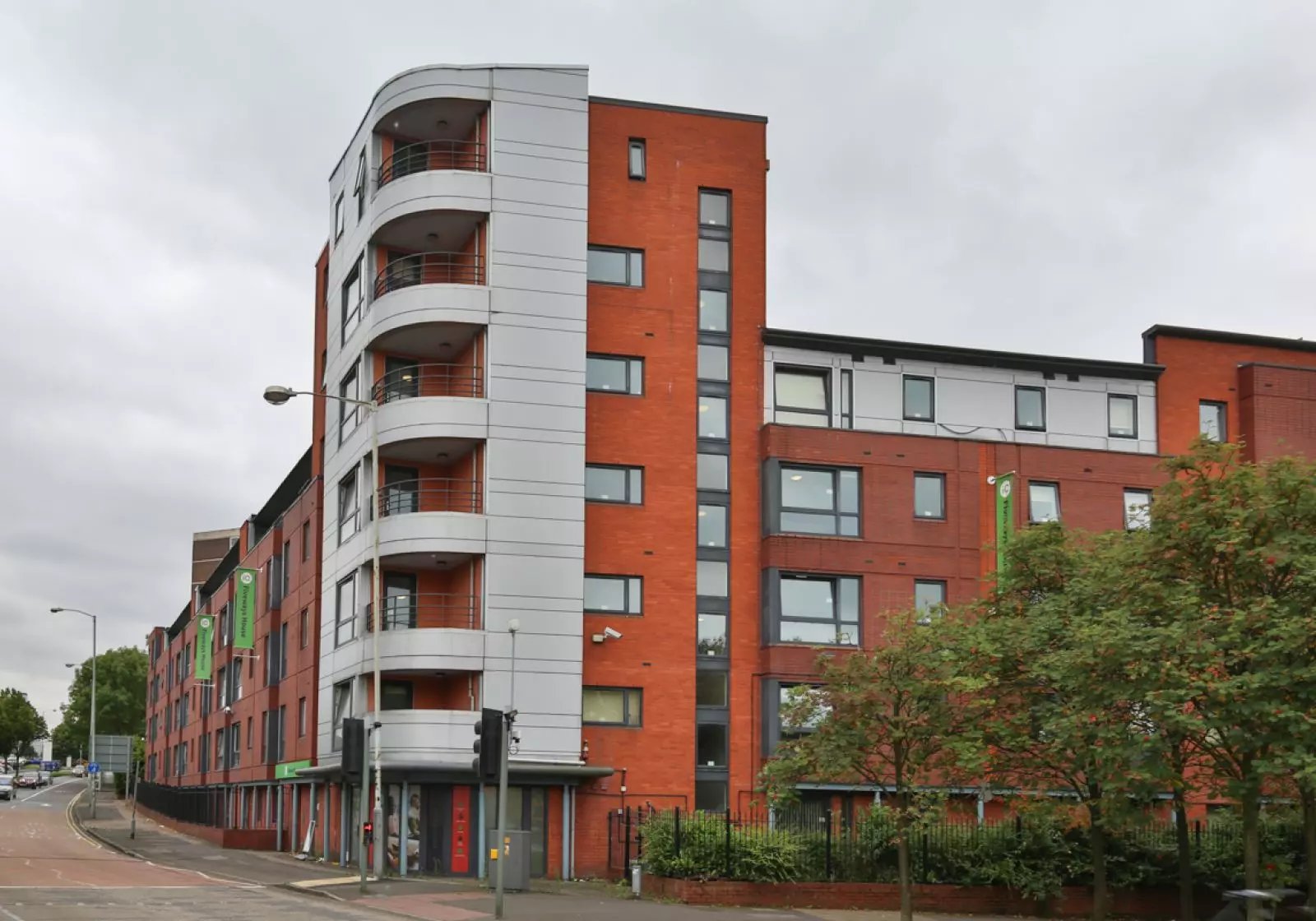 Red brick building with balconies exterior at iQ Fiveways House in Wolverhampton Student Accommodation