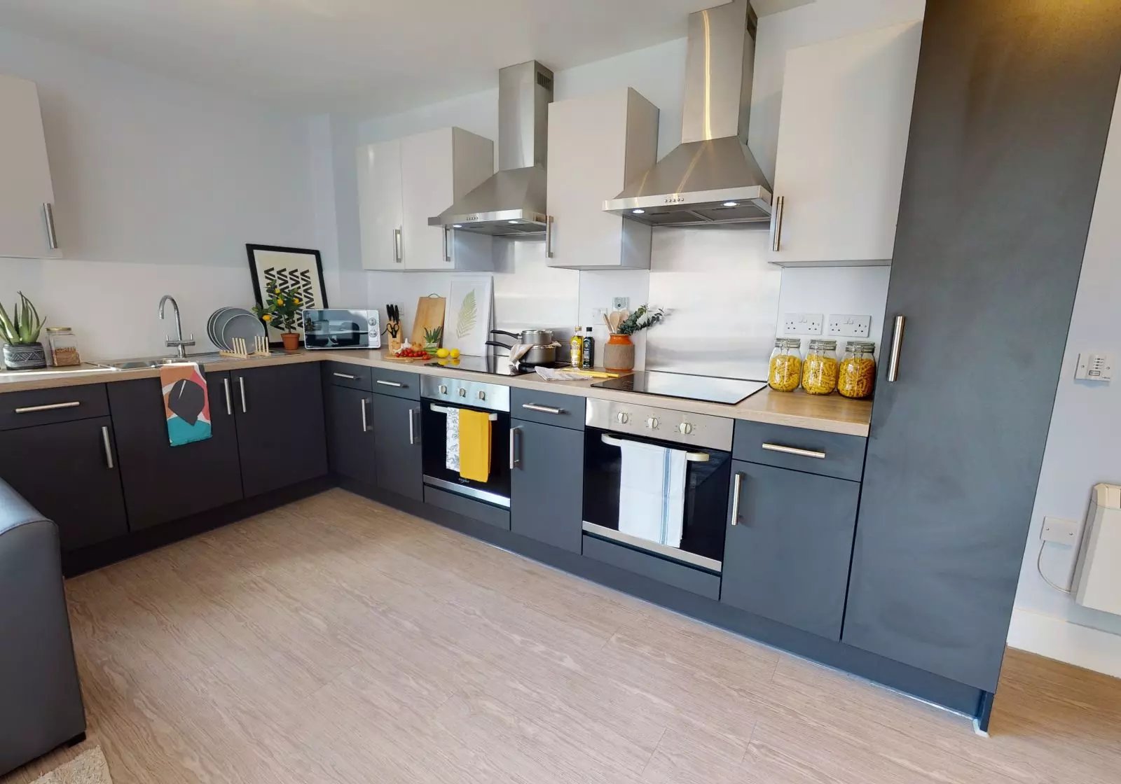 Modern kitchen with dark cabinets and ovens Kitchen at iQ Magenta House in London Student Accommodation