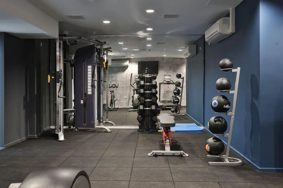 Gym equipment dumbbells exercise balls bench living room at Princess Road East in Leicester Student Accommodation