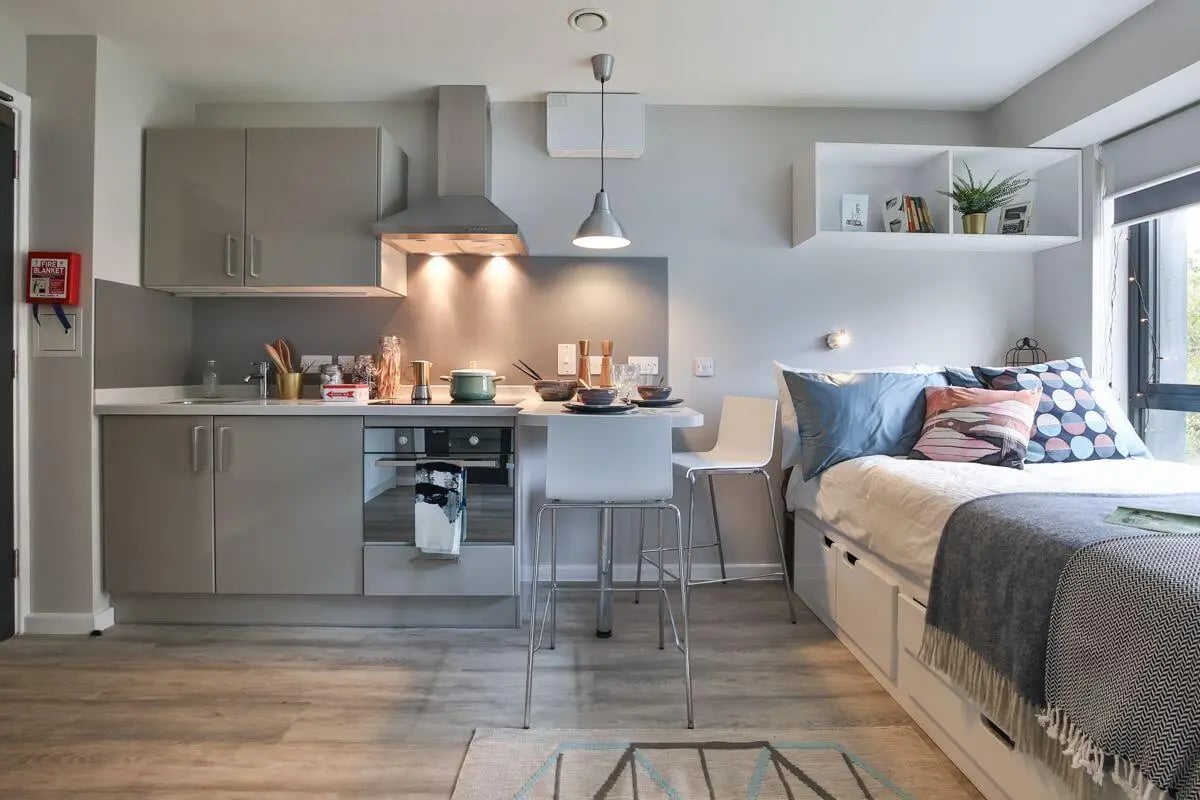 Modern studio kitchen with bed and dining area studio apartment at Princess Road East in Leicester Student Accommodation