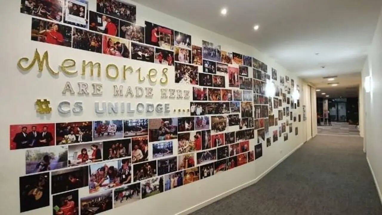 Photo wall with text memories are made here corridor at Student Living - 800 Swanston in Melbourne Student Accommodation