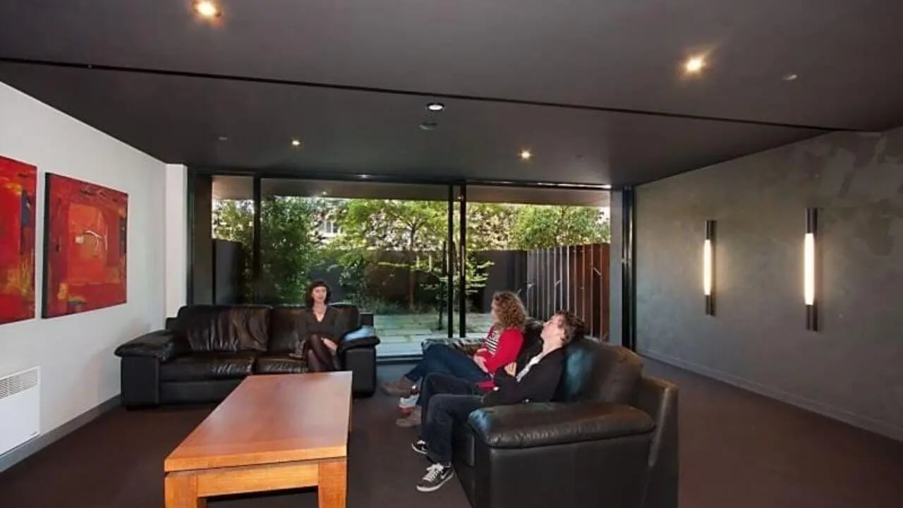 Sofa and coffee table with people living room at Student Living on Riversdale in Melbourne Student Accommodation