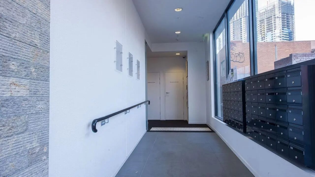 Mailboxes and doors in hallway exterior at Student Living on Cobden in Melbourne Student Accommodation