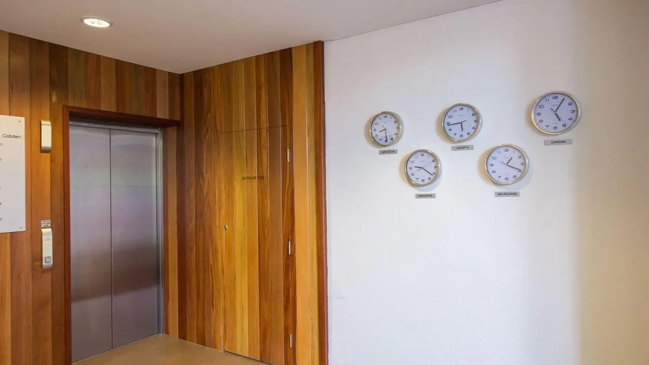 Lift and world clocks lobby at Student Living on Cobden in Melbourne Student Accommodation