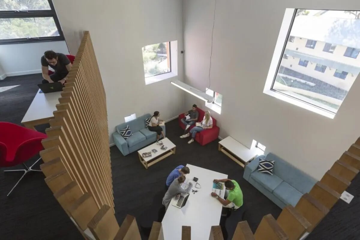 Students lounge study and use laptops living room at ECU Village Joondalup in Perth Student Accommodation