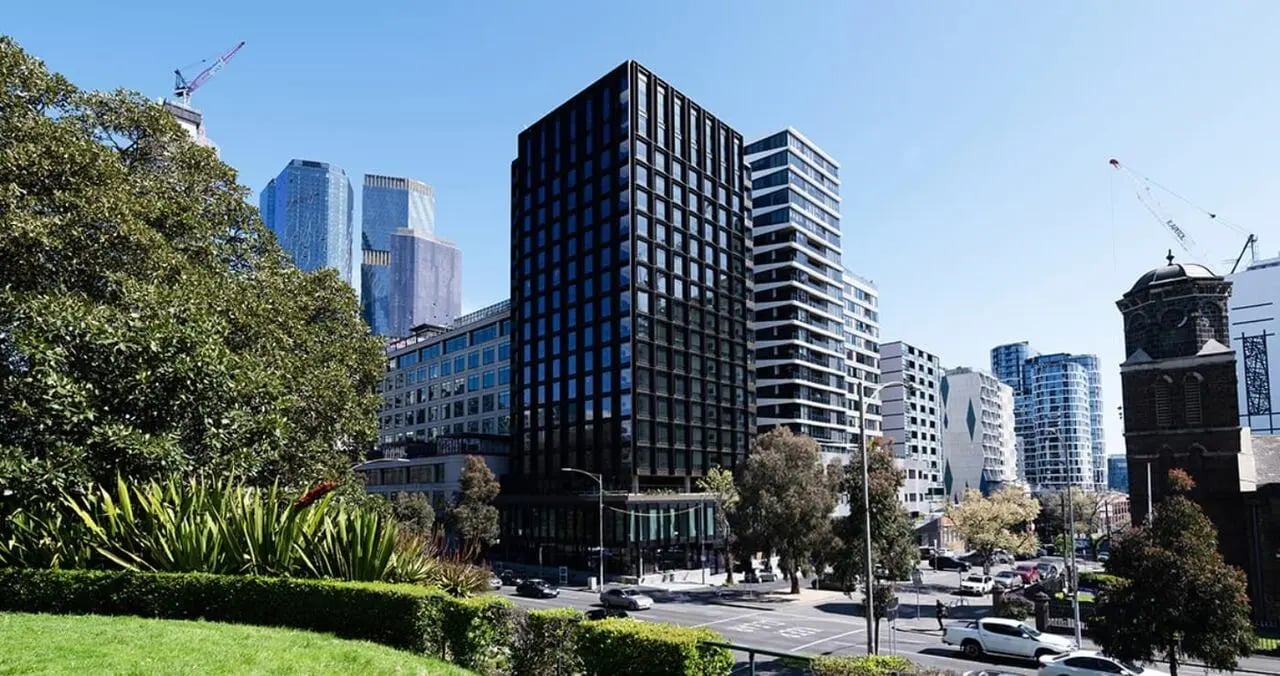 Modern black building city skyline greenery exterior at Iglu Flagstaff Gardens in Melbourne Student Accommodation