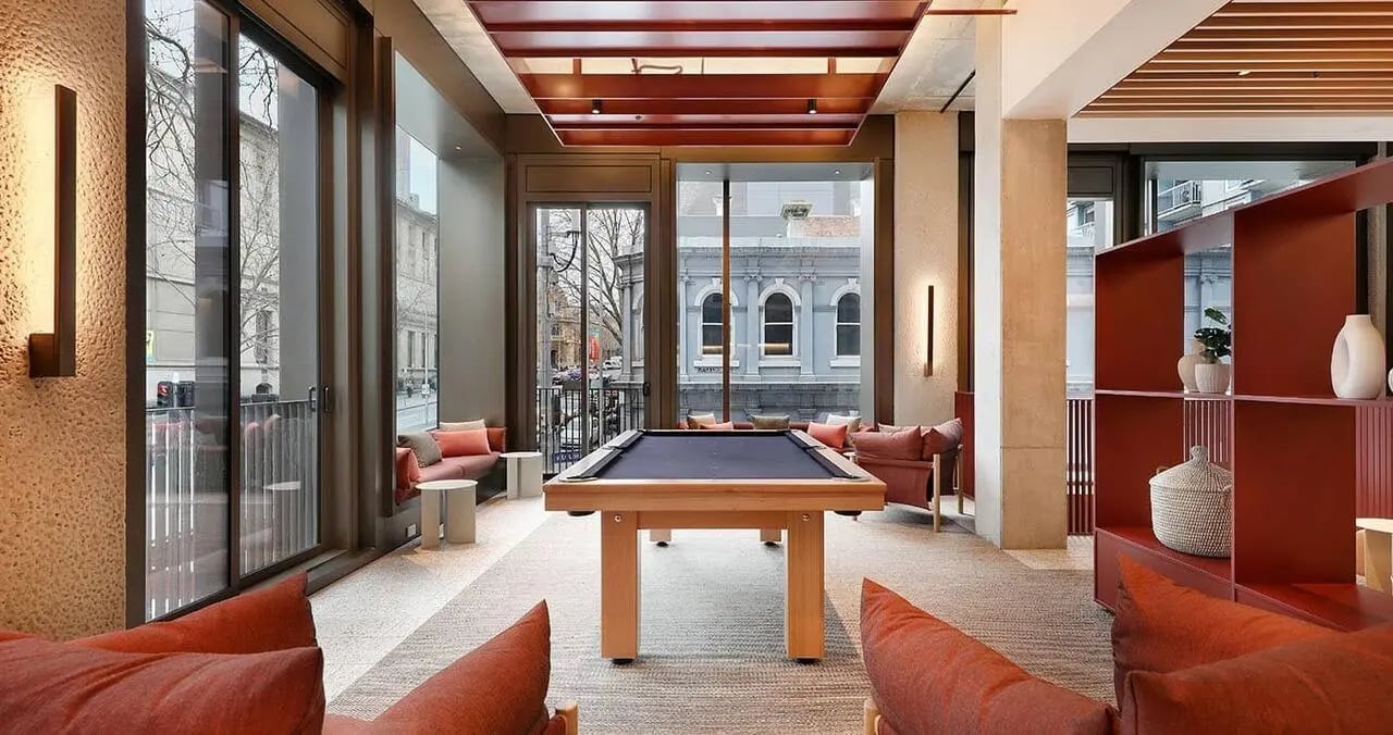 Pool table seating and shelving living room at Iglu Melbourne Central in Melbourne Student Accommodation