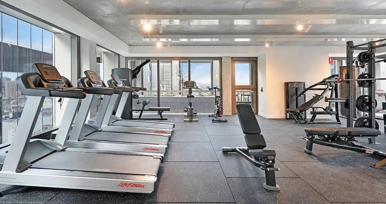 Treadmills weight rack and benches gym area at Iglu Melbourne Central in Melbourne Student Accommodation