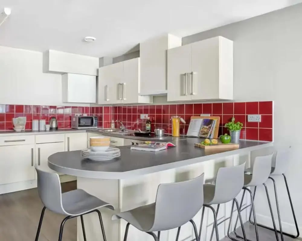 Modern kitchen with island and bar stools kitchen at Northfield in Exeter Student Accommodation