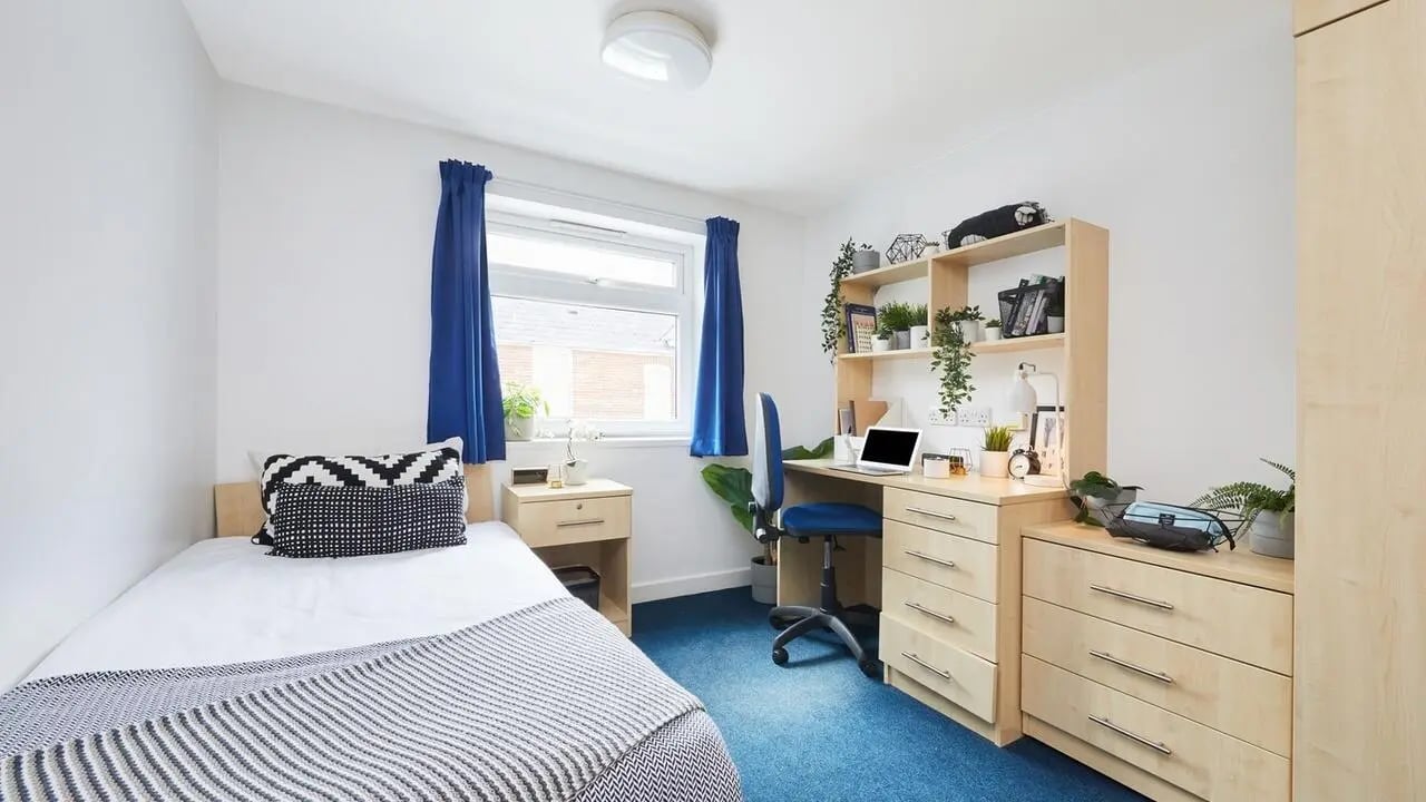Bed desk chair shelves drawers bedroom at Collegiate Bonhay House in Exeter Student Accommodation