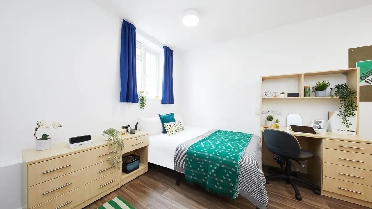 Bed desk plants dresser and speaker bedroom at Collegiate Bonhay House in Exeter Student Accommodation