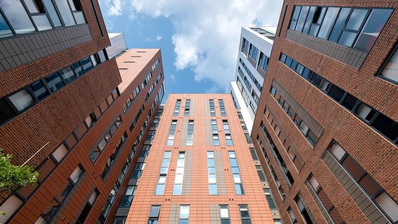 Modern brick buildings with many windows exterior at Collegiate Merlin Heights in Leicester Student Accommodation