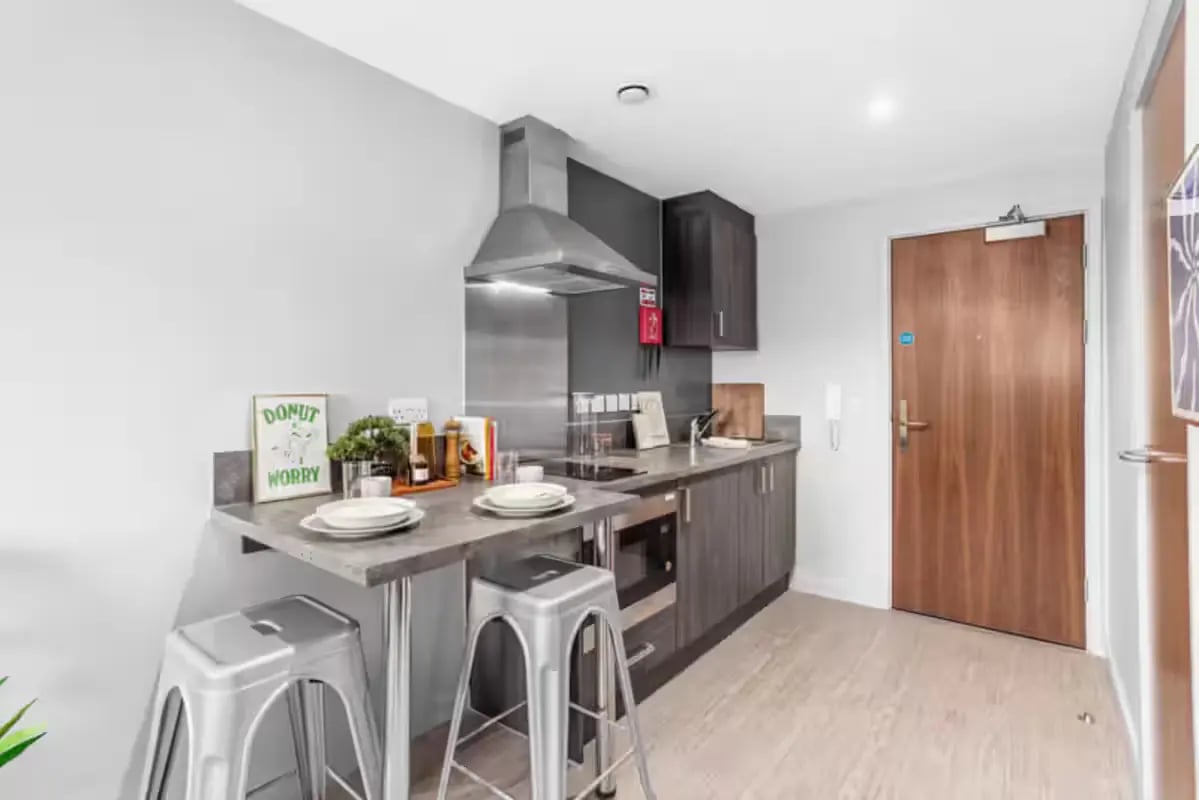 Kitchen counter stools and cabinets kitchen at Windsor House in Cardiff Student Accommodation