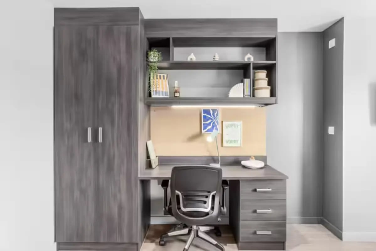 Wardrobe desk chair and shelves study area at Windsor House in Cardiff Student Accommodation