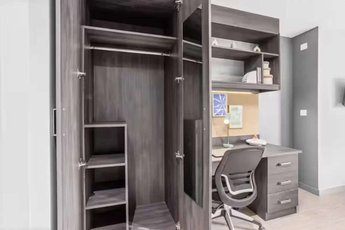 Wardrobe desk chair shelves study area at Windsor House in Cardiff Student Accommodation