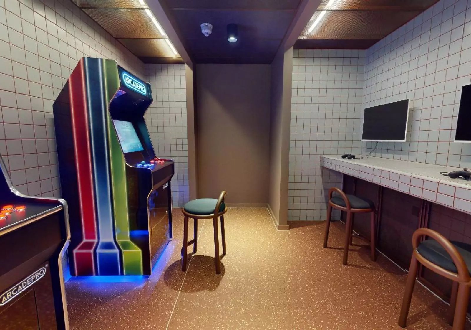 Arcade machines and computer stations gaming area at iQ City in London Student Accommodation
