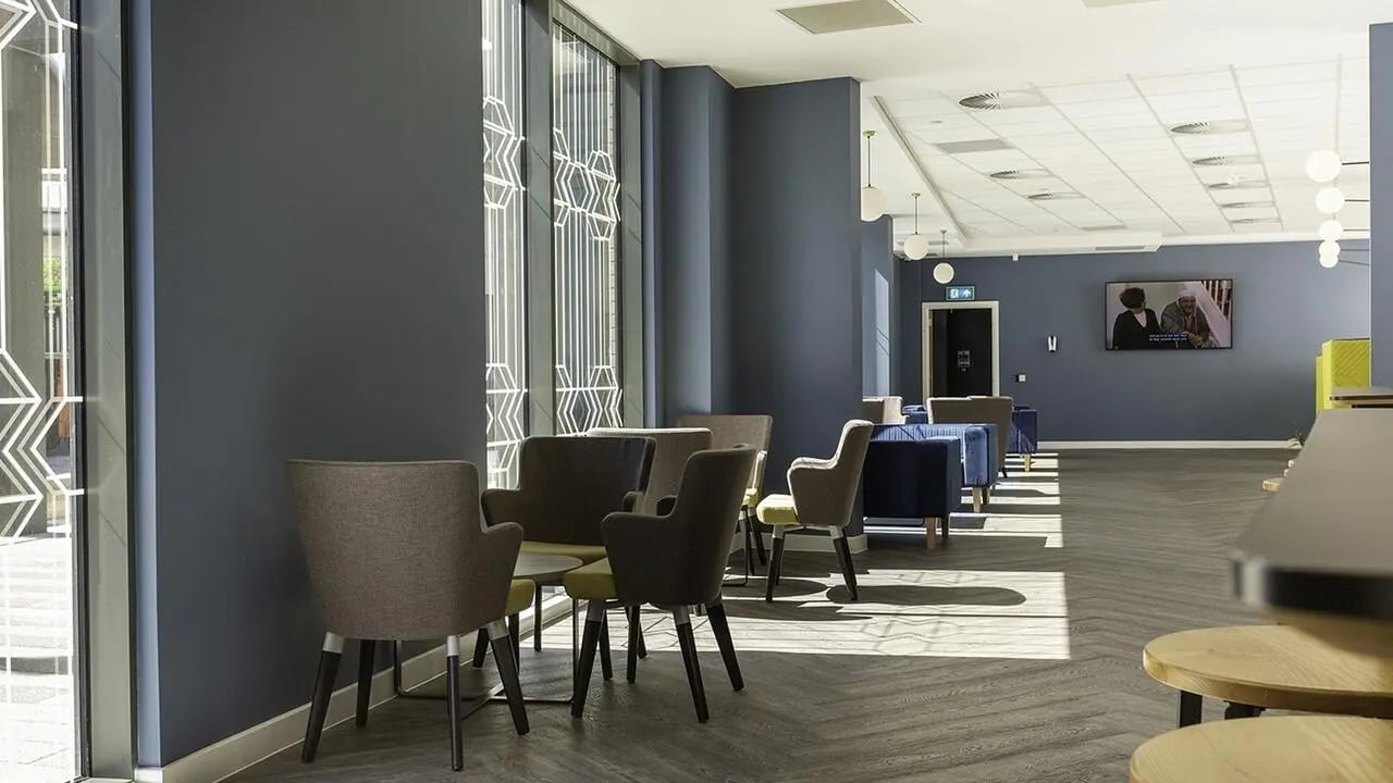 Comfortable seating arrangement with a TV lounge area at Collegiate Crown Place Norwich in Norwich Student Accommodation