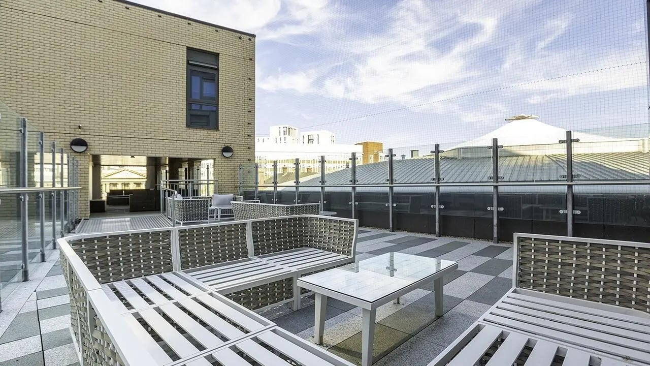 Outdoor seating with glass table terrace area at Collegiate Crown Place Norwich in Norwich Student Accommodation