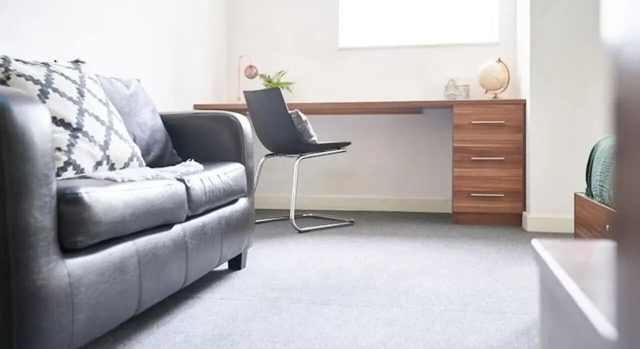 Sofa chair desk globe dresser living room at Windsor Court in Liverpool Student Accommodation