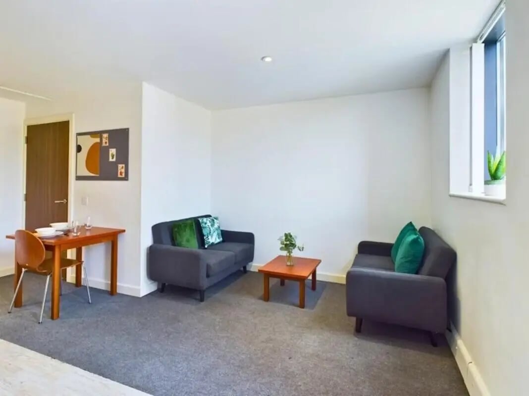 Sofa table chairs plant living room at Windsor Court in Liverpool Student Accommodation