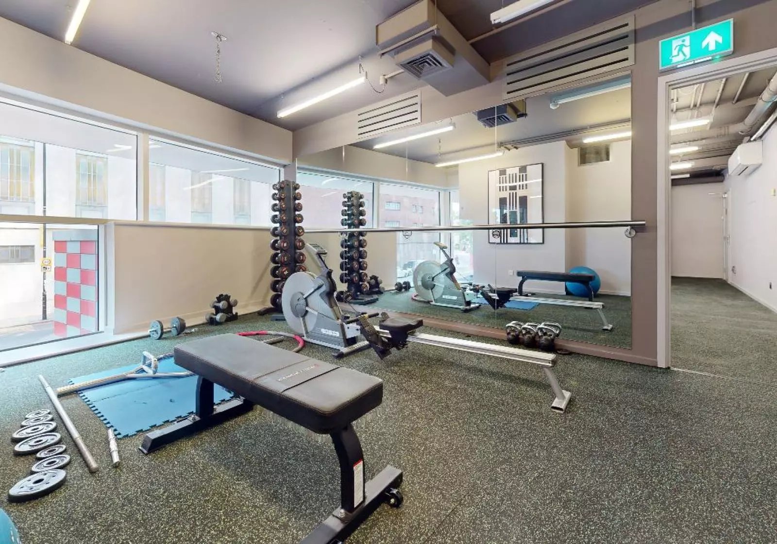 Dumbbells rowing machines bench weights gym area at iQ Highbury in London Student Accommodation