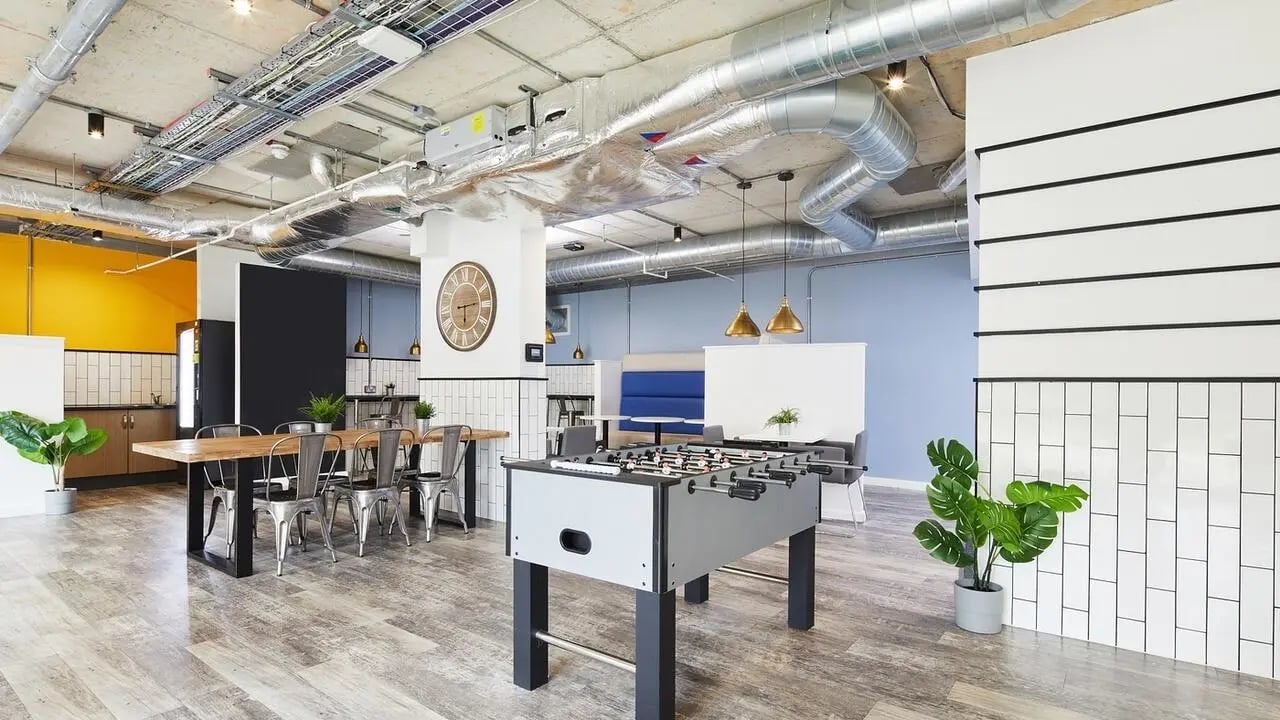 Foosball table dining table and kitchen communal area at Collegiate Riverside Way Winchester in Winchester Student Accommodation