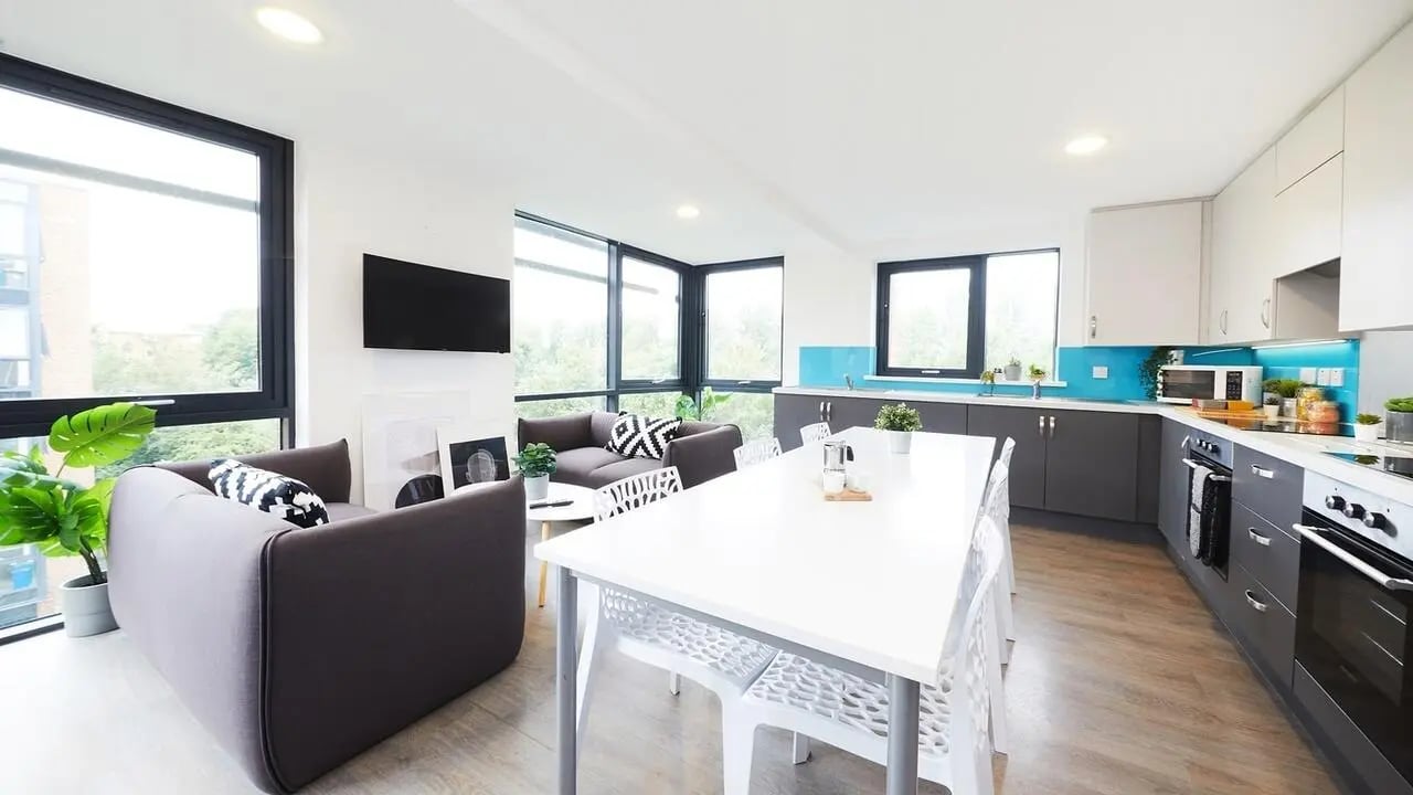 Sofa television dining table kitchen living room at Collegiate Riverside Way Winchester in Winchester Student Accommodation